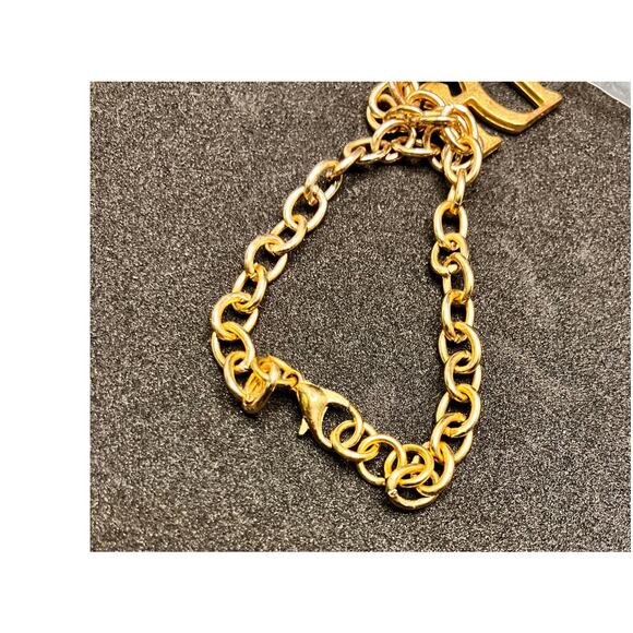 DIAMONDS INTERNATIONAL "Di" GOLD TONE LINK CHARM BRACELET AND Dolphin CHARM - Picture 4 of 8